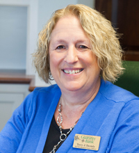 Professional woman with short hair smiling