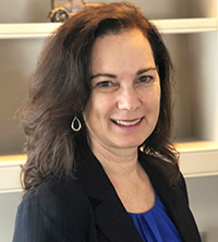 Professional woman with long hair wearing business attire